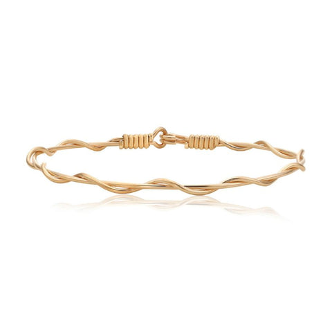 Gold bracelet with two wires twisted
