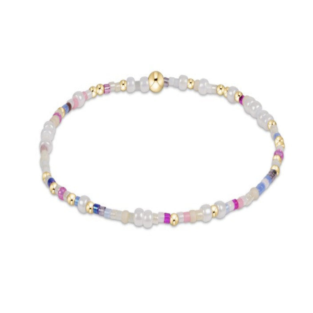 White, Blue and Pink beaded bracelet with gold accent beads