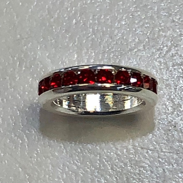 silver circle charm with ruby stones