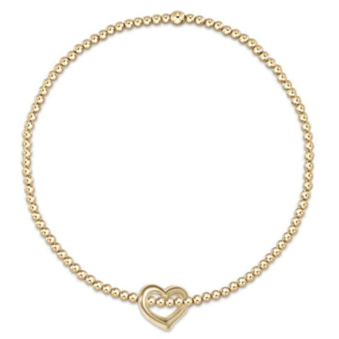 Gold beaded bracelet with heart charm