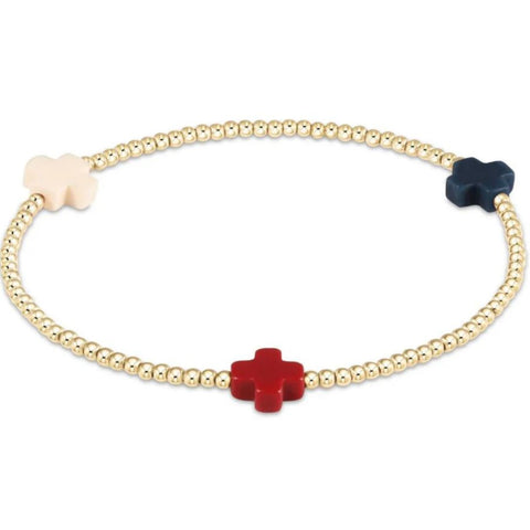 Gold beaded bracelet with red, white and blue cross