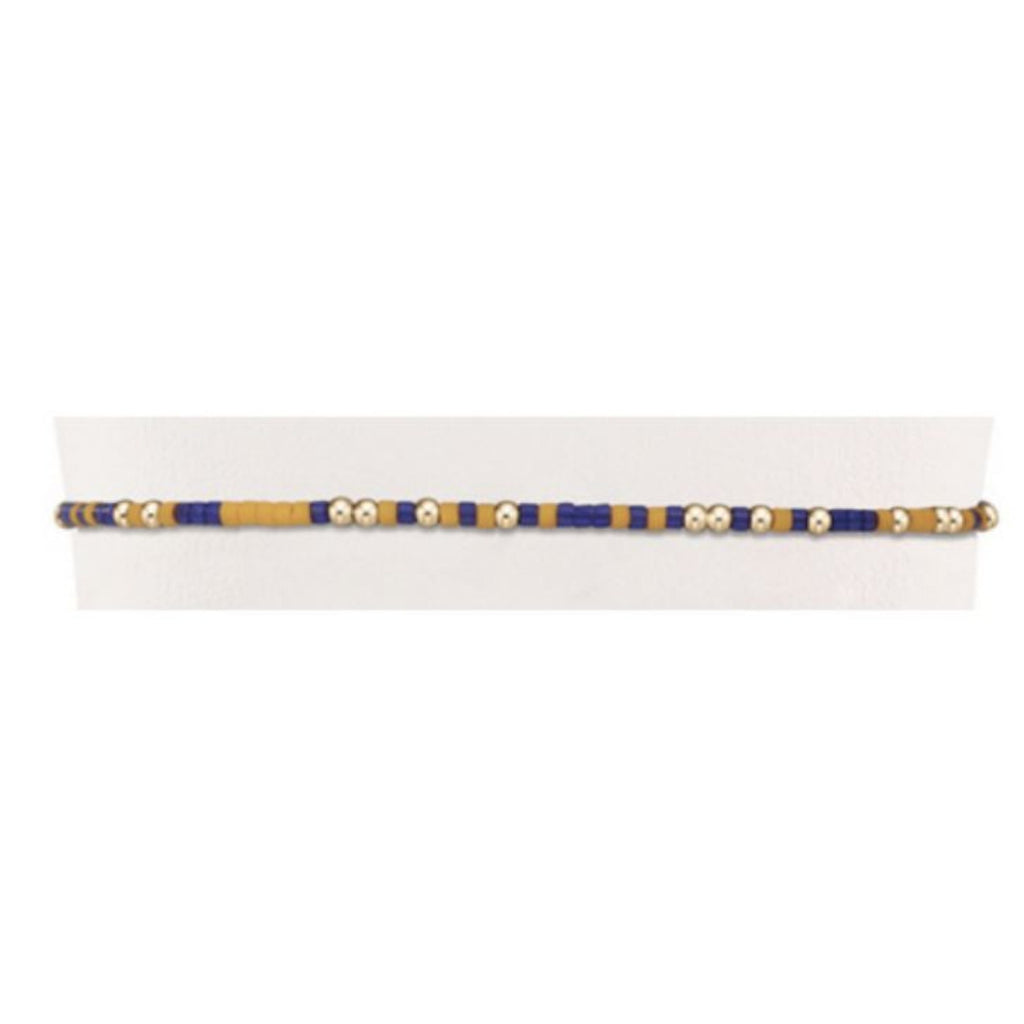 Purple, yellow and gold bead bracelet