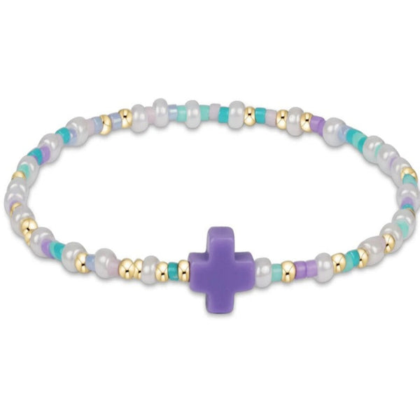Bracelet with a purple cross charm and multicolored beads on a white background