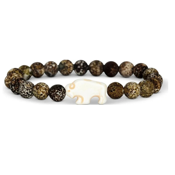 A beaded stretch bracelet featuring natural brown and black speckled beads, with a central white carved animal-shaped charm, photographed on a clean white background.
