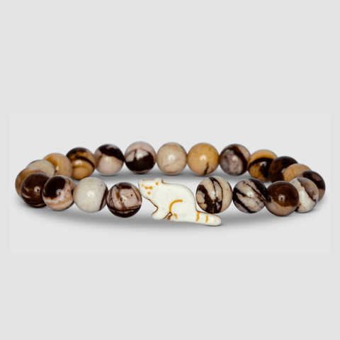 Brown Beaded bracelet with a red panda shaped charm on a light gray background