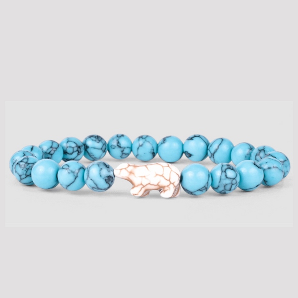 Blue beaded bracelet with beige polar bear
