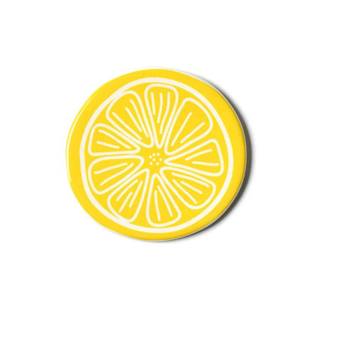 Round yellow coaster with white lemon slice design on a white background