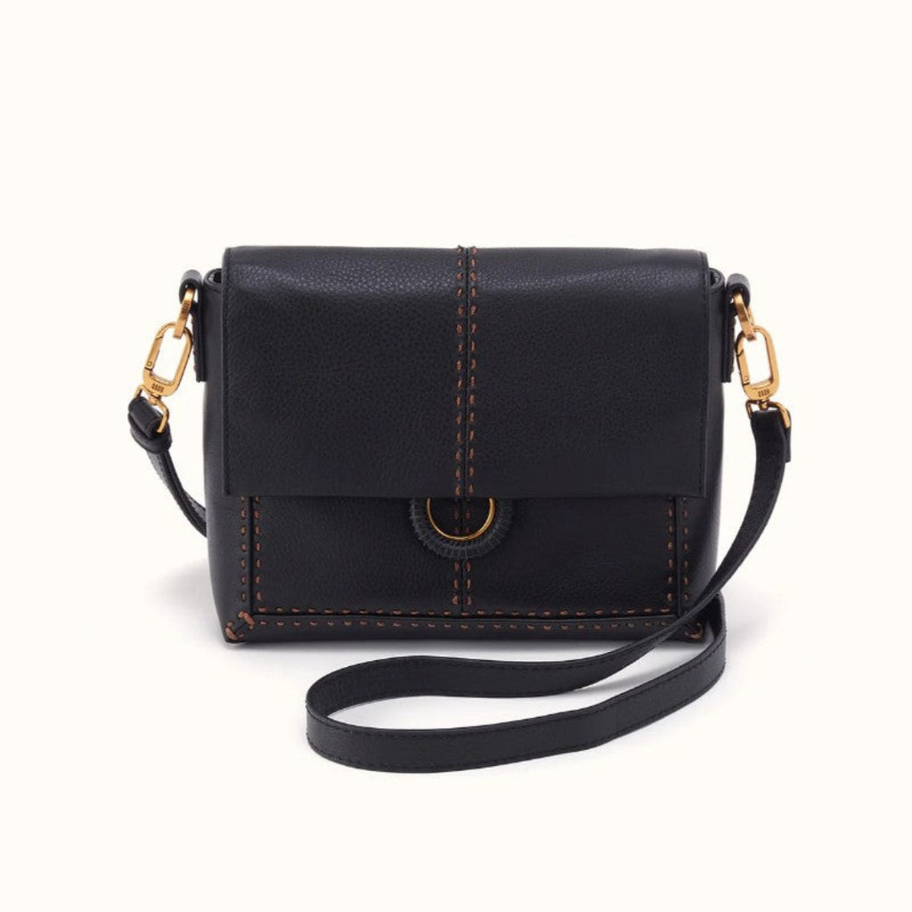 A black pebbled leather crossbody bag with gold-tone hardware and contrast brown stitching, shown on a clean off-white background.