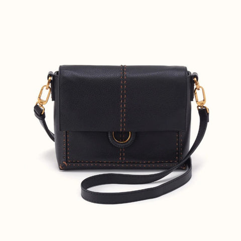 A black pebbled leather crossbody bag with gold-tone hardware and contrast brown stitching, shown on a clean off-white background.
