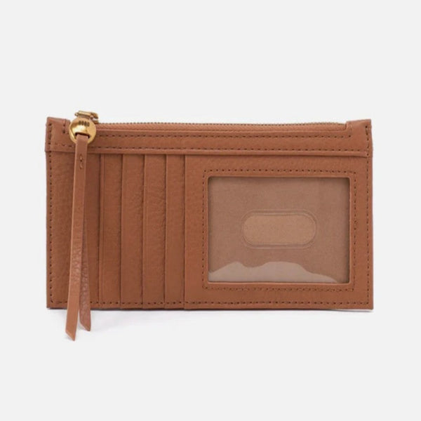 A brown leather zip-around card holder wallet with multiple vertical card slots, a clear ID window, and a gold-tone zipper pull, shown against a plain white background.