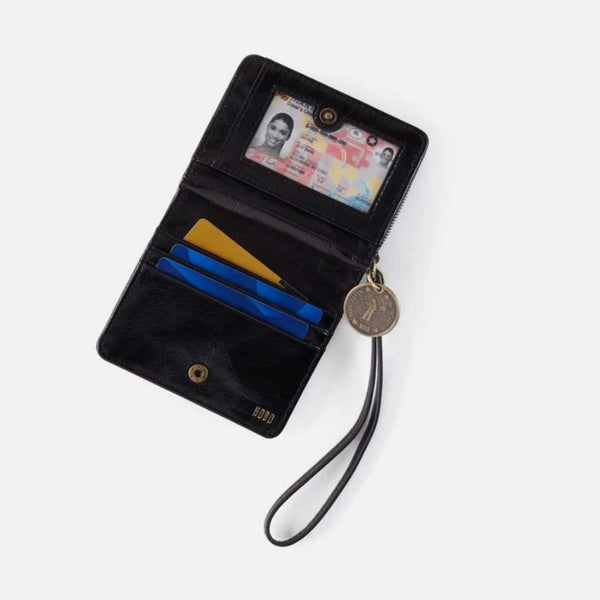 A black leather wallet with a wrist strap and coin purse, shown open on a light gray background. The wallet contains demo cards and an ID card, and features gold-tone hardware.