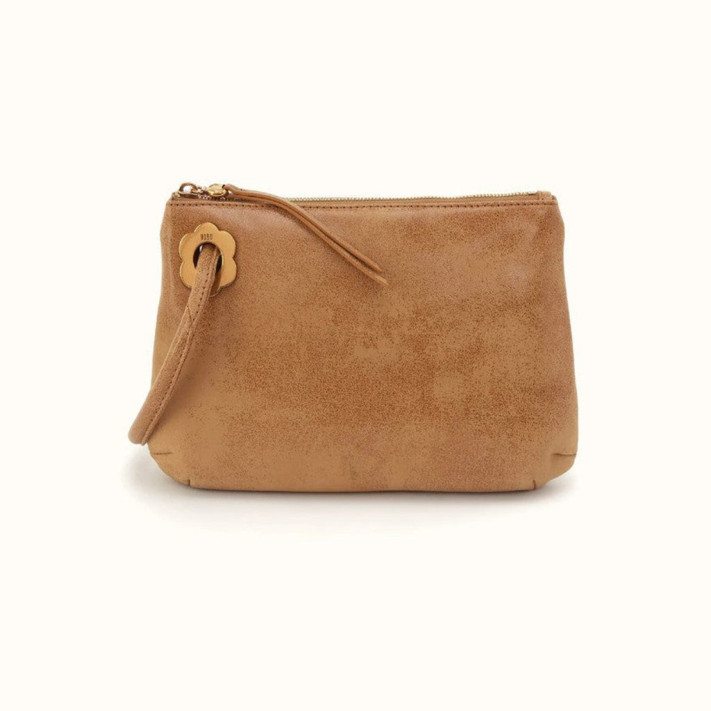 A tan faux-leather zippered pouch with a matching wristlet strap and a flower-shaped gold-tone metal clasp, shown against a plain white background.