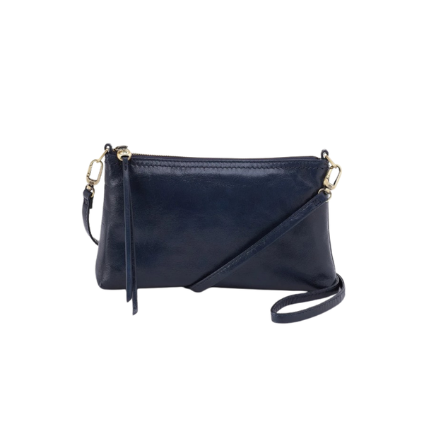 A navy blue leather crossbody clutch bag with gold-tone hardware, a top zipper, a tassel detail, and a thin shoulder strap, shown on a plain off-white background.