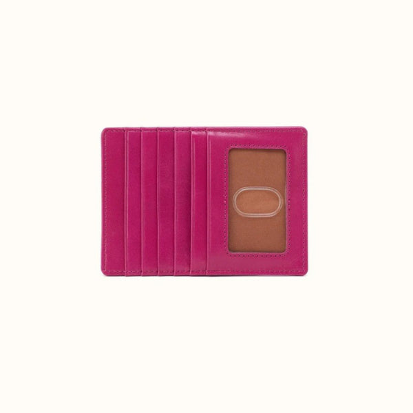 Pink leather wallet with a card holder on a white background