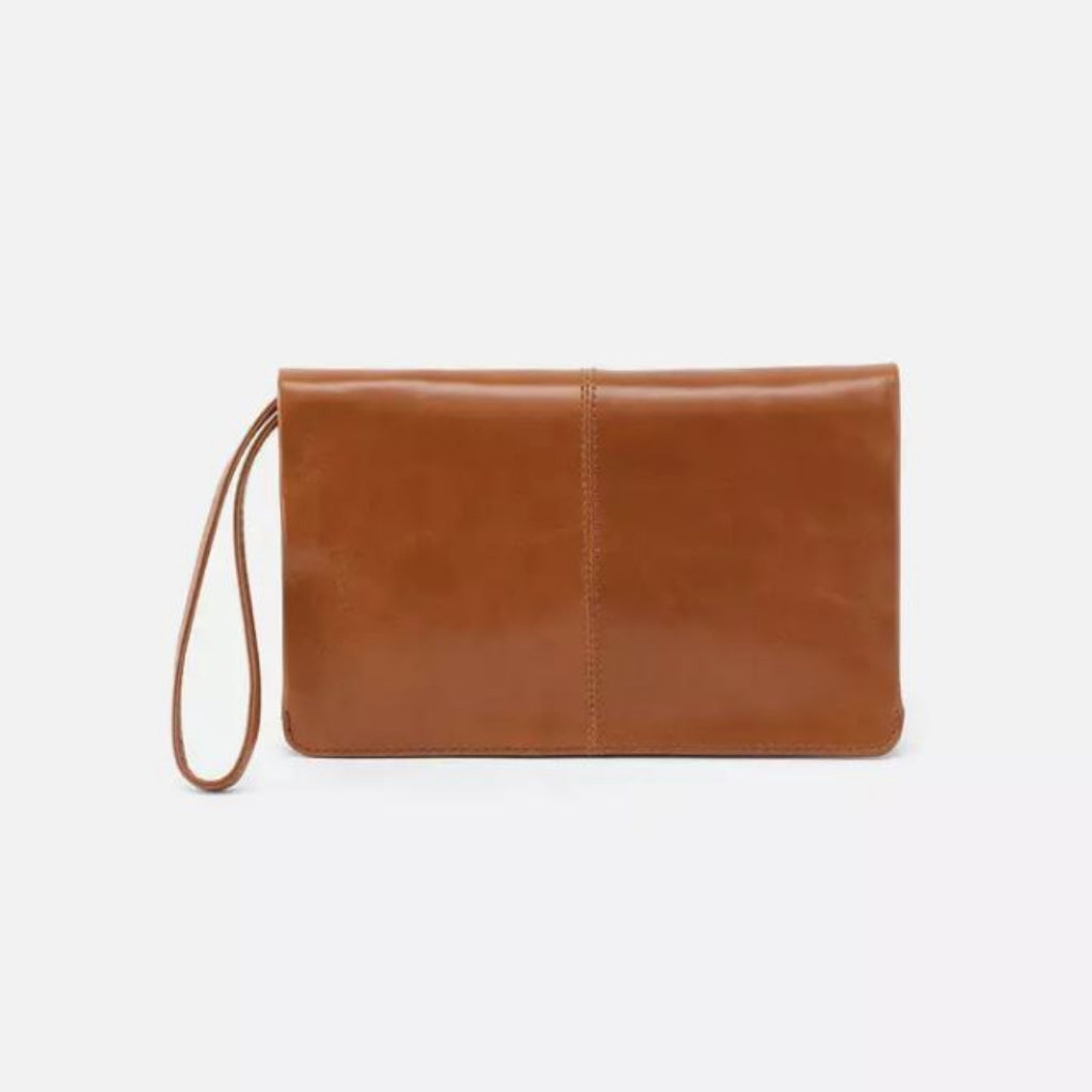 A tan leather clutch bag with a wrist strap, shown against a plain white background.