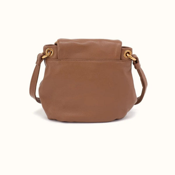 A brown pebbled leather shoulder bag with a top flap and gold-tone hardware, shown against a plain off-white background.