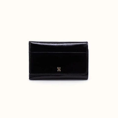A black patent leather bi-fold wallet with a small gold double-X logo on the front, photographed against a plain off-white background.