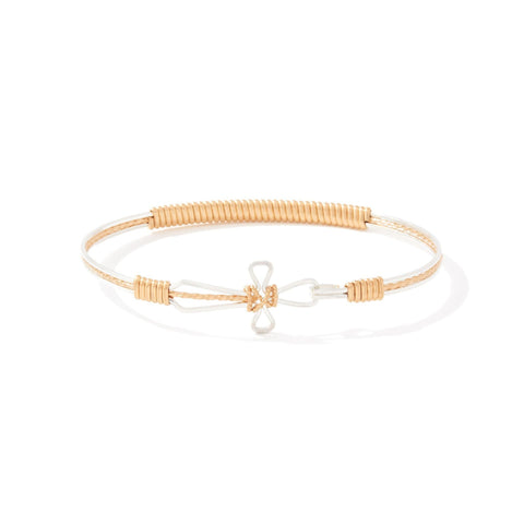 Gold bracelet with a cross design on a white background