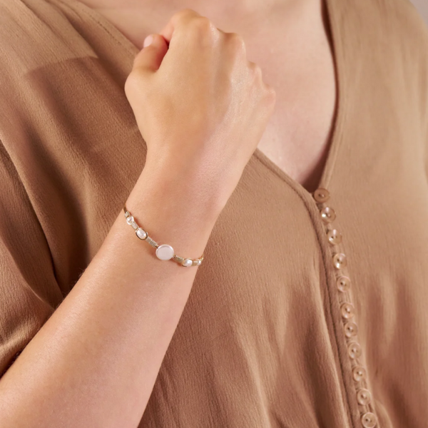 Woman's Arm with Gold Bracelet with Pearls