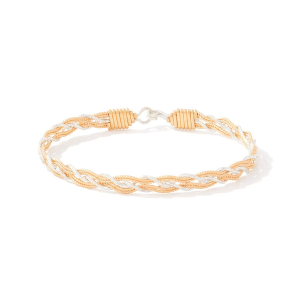 Gold and silver braided bracelet on a white background