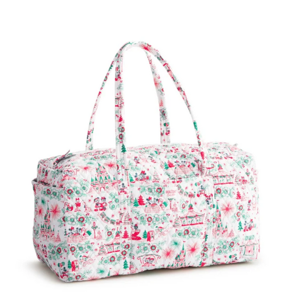 A duffel bag with a white background and a festive Christmas-themed print in red, green, and pink, featuring two top handles and a zippered closure.