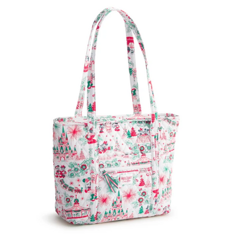 A white fabric tote bag with a festive Christmas print featuring red and green illustrations of trees, ornaments, and snowflakes, shown on a clean white background.