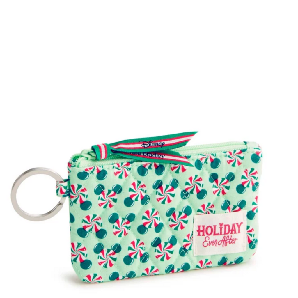 A mint green zippered pouch with a candy cane pattern, featuring a silver key ring and a decorative striped ribbon bow. A white label on the front reads 'HOLIDAY EverAfter'.