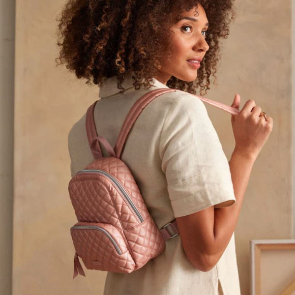 Lady wearing the Rose Quartz Mini Backpack