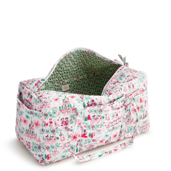 A duffel bag with a white background and a festive Christmas-themed print in red, green, and pink, featuring two top handles and a zippered closure.