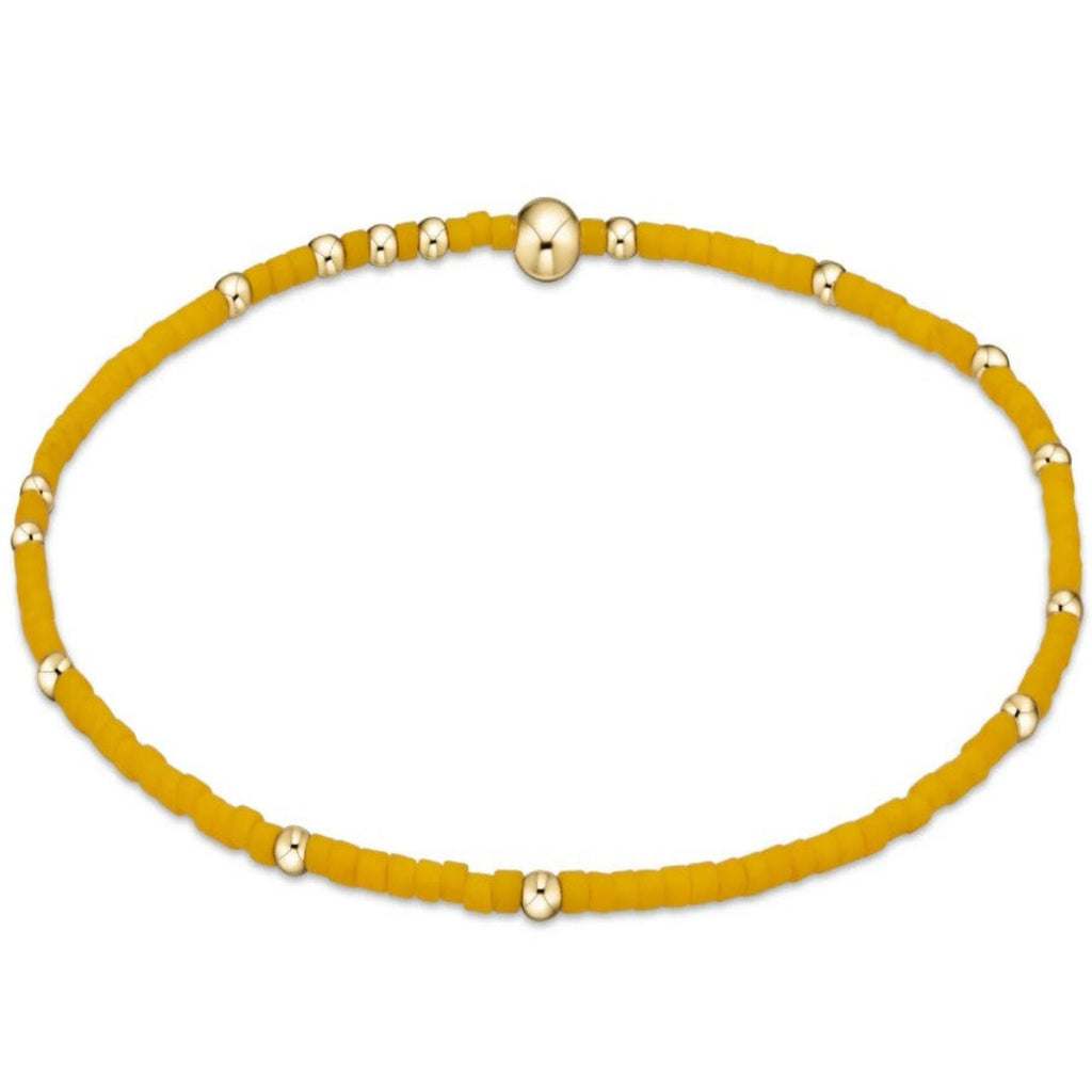 Yellow beaded bracelet on white background