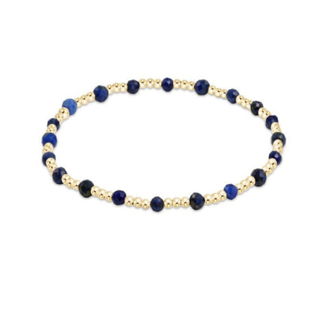 Necklace with blue and gold beads on a white background