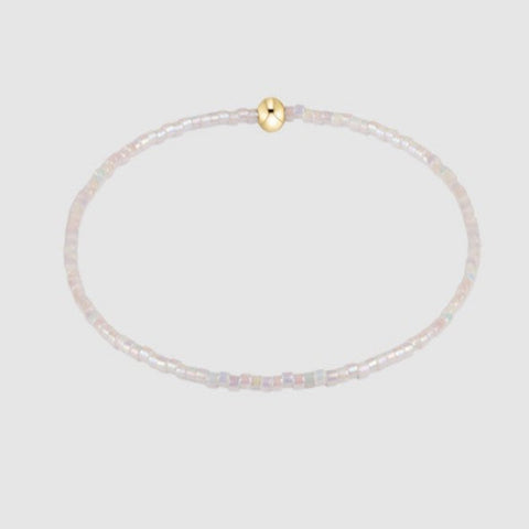 White Beaded Bracelet on Gray Background