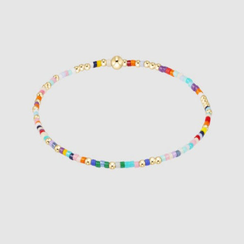 Multicolored beaded necklace on a light gray background