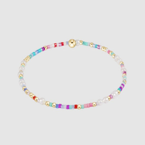 Multicolored beaded necklace on a light gray background