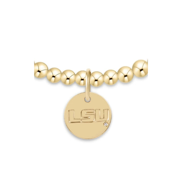 Gold beaded bracelet with a LSU pendant on a white background