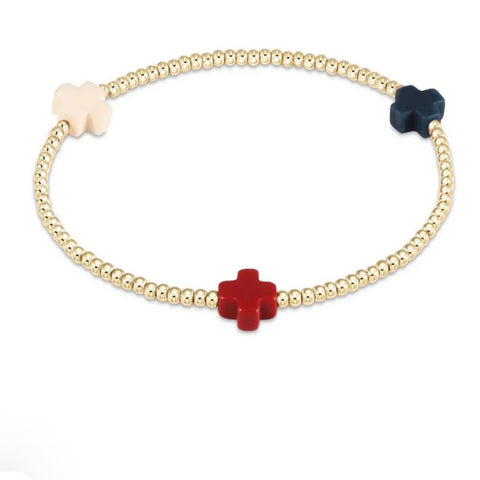 Gold beaded bracelet with red, white and blue cross